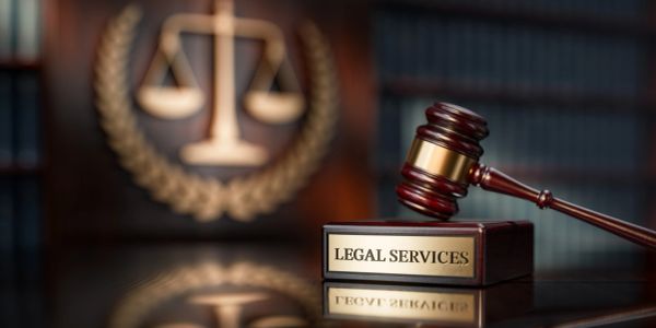Gavel and legal services sign on desk