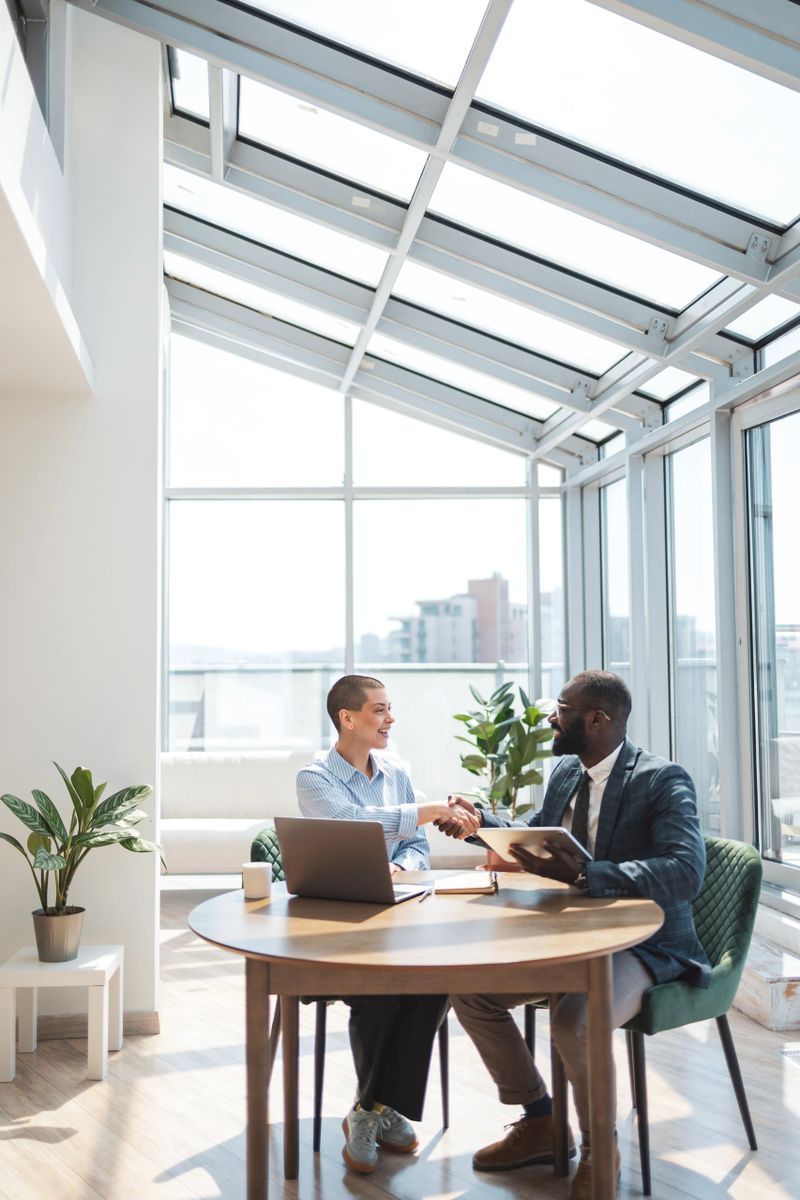 A diverse team discussing and arriving at an agreement in a bright workspace. Collaboration.