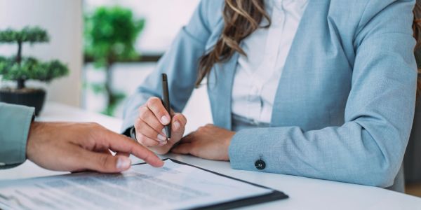 Signing a contract or agreement.