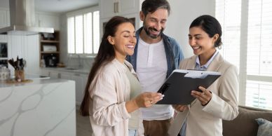 Real estate agent discussing home details with a couple.