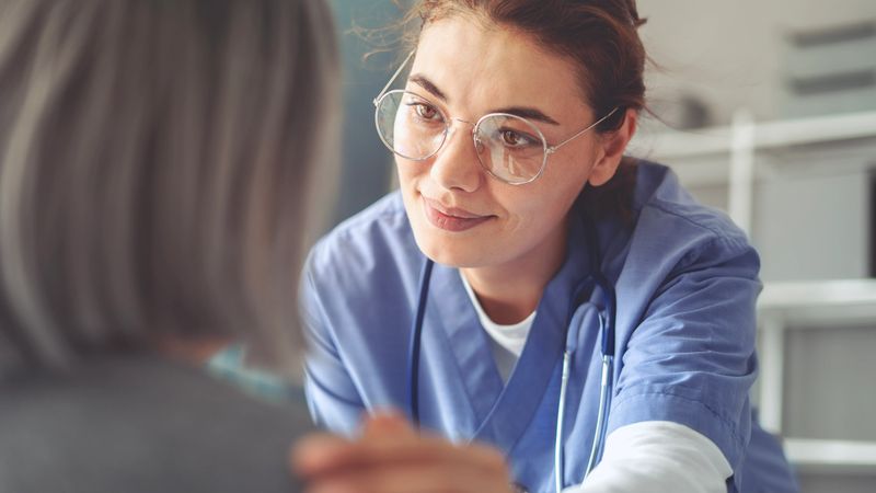Healthy lifestyle and medical concept, the healthcare worker talks to the elderly patient and comforts her