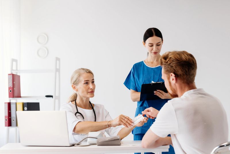 Healthcare professional at desk reviewing documents
