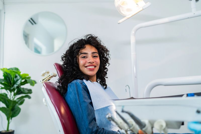 Portrait of young patient woman at dentist's office