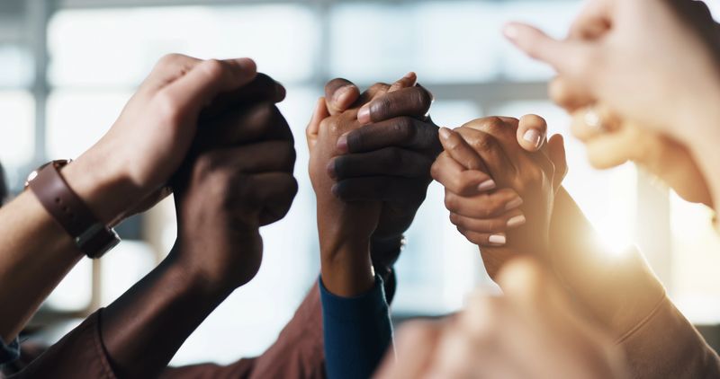 Community, holding hands and business people in unity for support, faith and solidarity in office. Men, women or group together for prayer, collaboration and trust with commitment and praise
