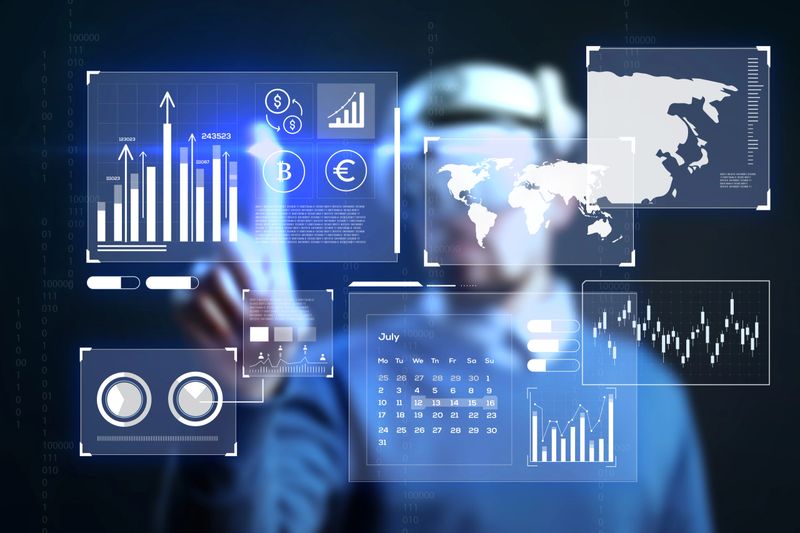 A professional interacts with advanced digital displays showing graphs, financial data, and geographical information in a sleek office setting.