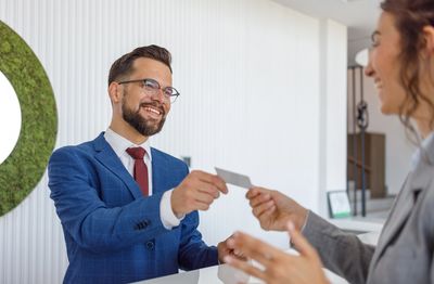 Handing over a business card printed in Leadville