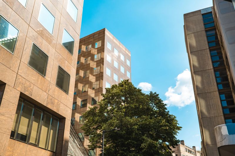 Modern office buildings reflecting sunlight in london's financial district