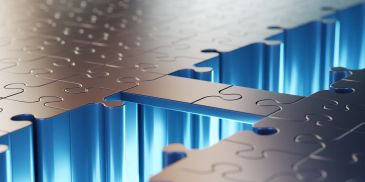 Close-up of a puzzle piece fitting perfectly.