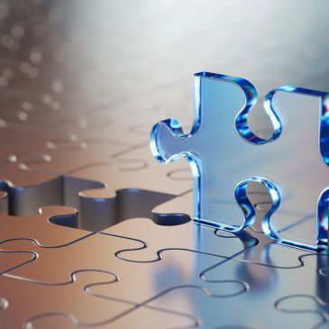 A blue puzzle piece about to fit into a puzzle.