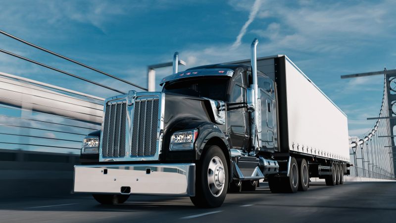 American style truck on freeway pulling load. Transportation theme. 3D illustration