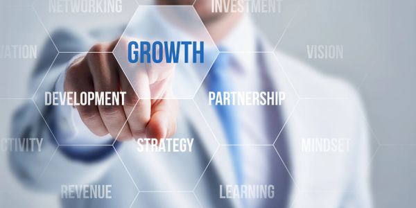 Businessman pointing at growth concept on virtual screen.