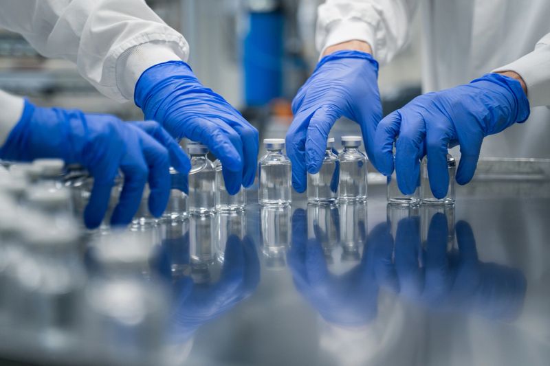 Interior view of pharmaceutical manufacturing and person working to keep production moving