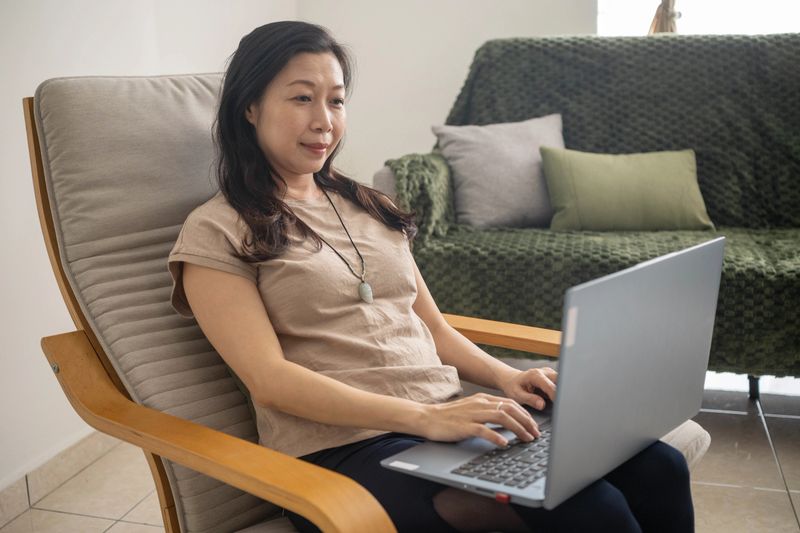 A portrait capturing the simplicity and sophistication of a girl adorned with a striking pendant.