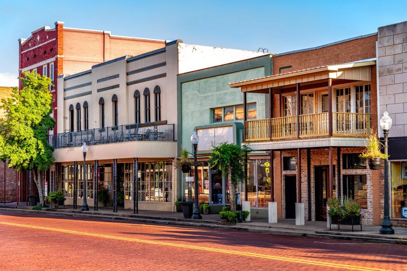 A variety of shops and restaurants in old historic buildings along the idyllic Main Street in Nacogdoches, Texas...