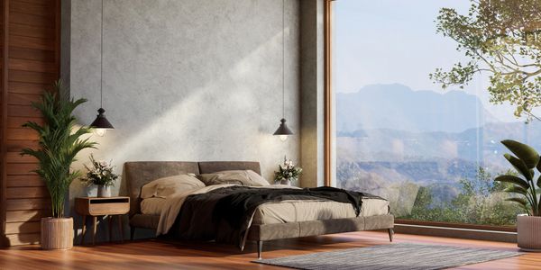Modern bedroom with scenic mountain view through large window.