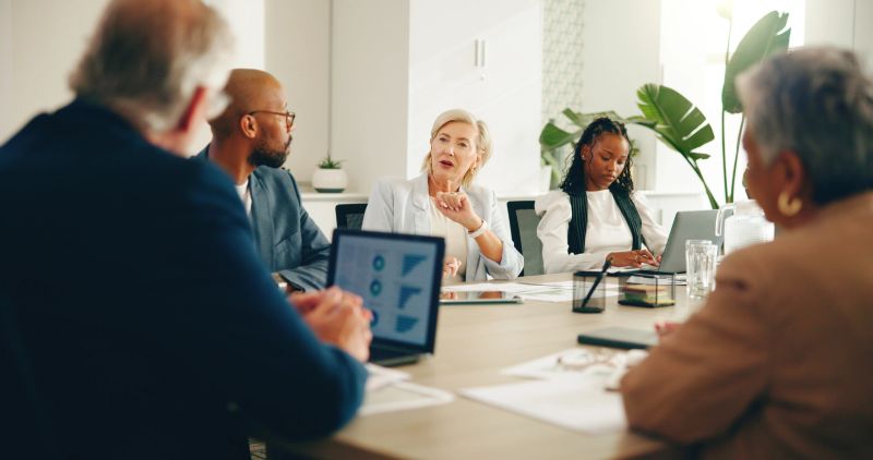 Business team in boardroom discussing risk management