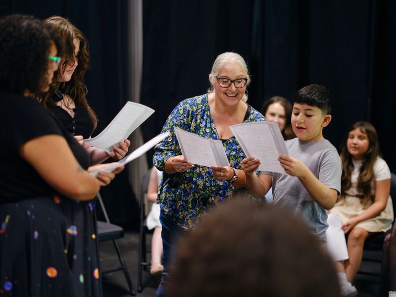 A community theater group rehearsing a play.