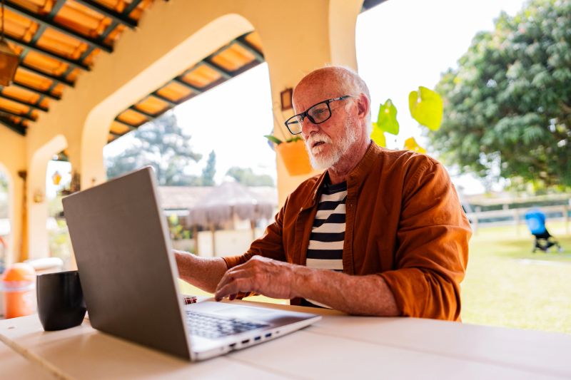 Senior man working on the laptop at home