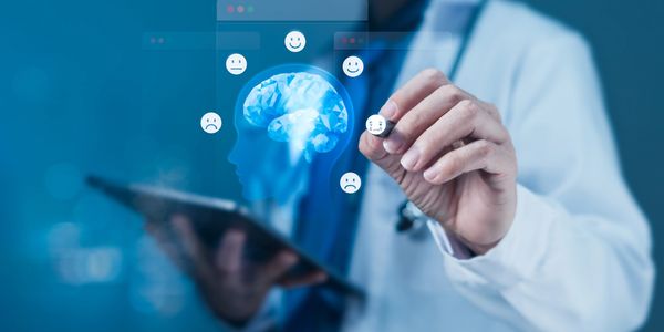 Doctor interacting with digital brain and mood icons.