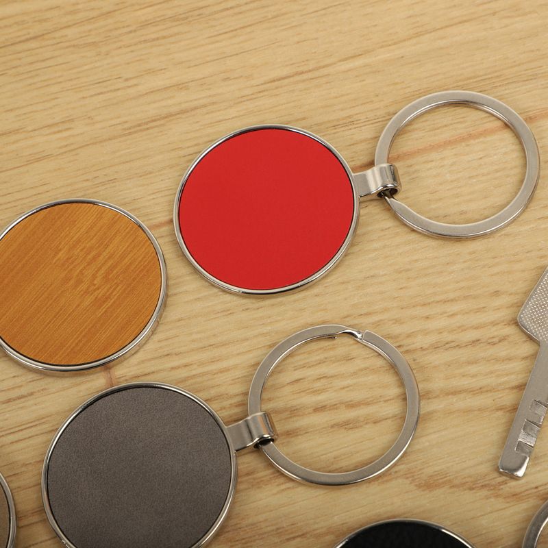 Metal and leather keychains. Colorful one side leather; Square, rectangle and circle shaped key rings. Concept shots,