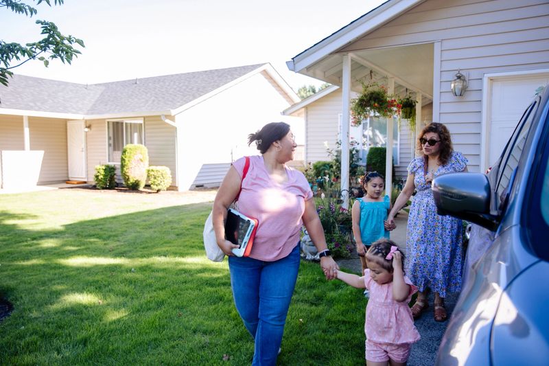 Authentic photo of a Multigenerational Latine Family Leaving the house for a family fun day. Shown in the photos are 3 generations, daughters, mother and grandmother.
