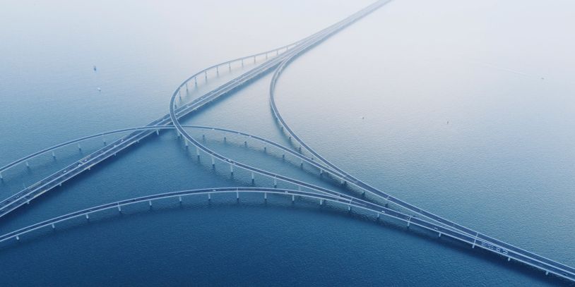 Aerial view of interconnected bridges over water.