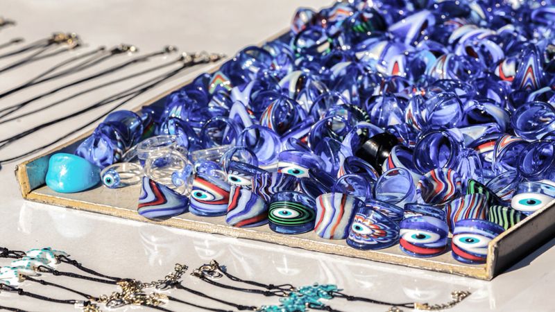 Evil eye glass rings and handcrafted jewelry at street souvenir stand in Bodrum, Turkey