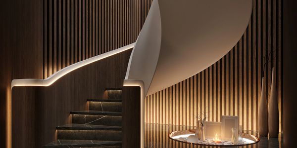 Elegant modern staircase with warm lighting and wooden panel walls.
