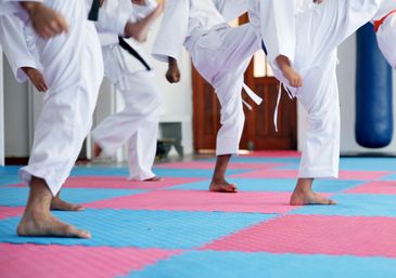 Martial arts students during a belting ceremony.