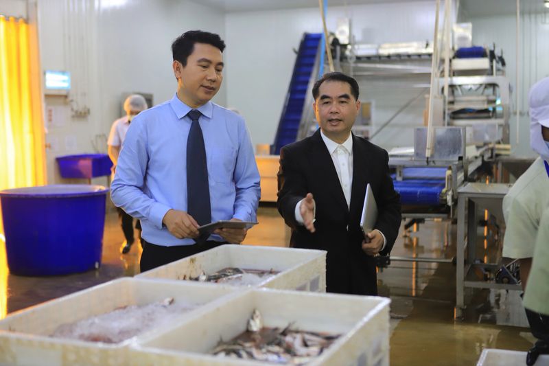 two businessmen meeting and discuss in food factory