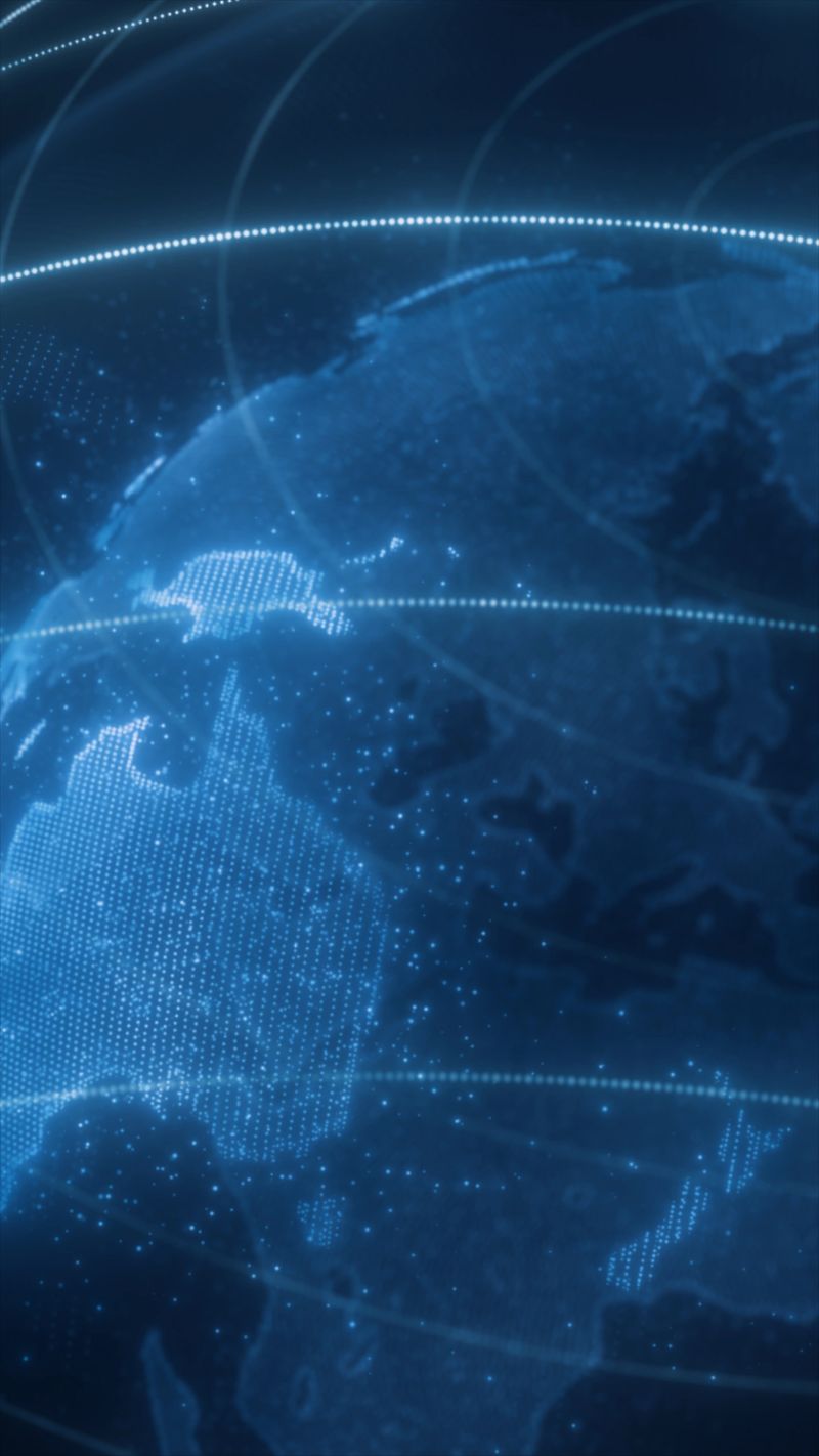 Digital globe with glowing data lines orbiting around continents on a dark blue background.