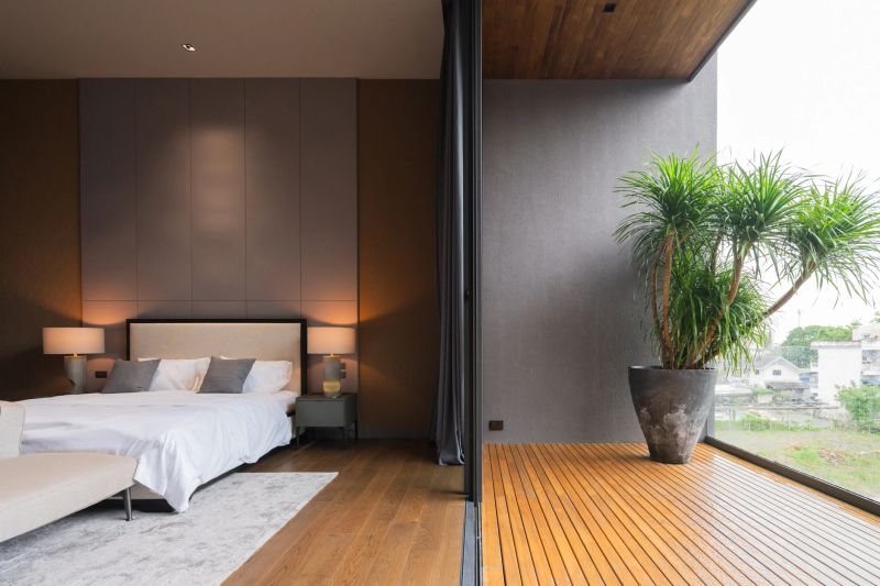 Modern contemporary bedroom showcases biophilic design with natural daylight and earthy color palette. Sustainable interior features organic textures minimalist aesthetics, and hygge inspired cozy atmosphere