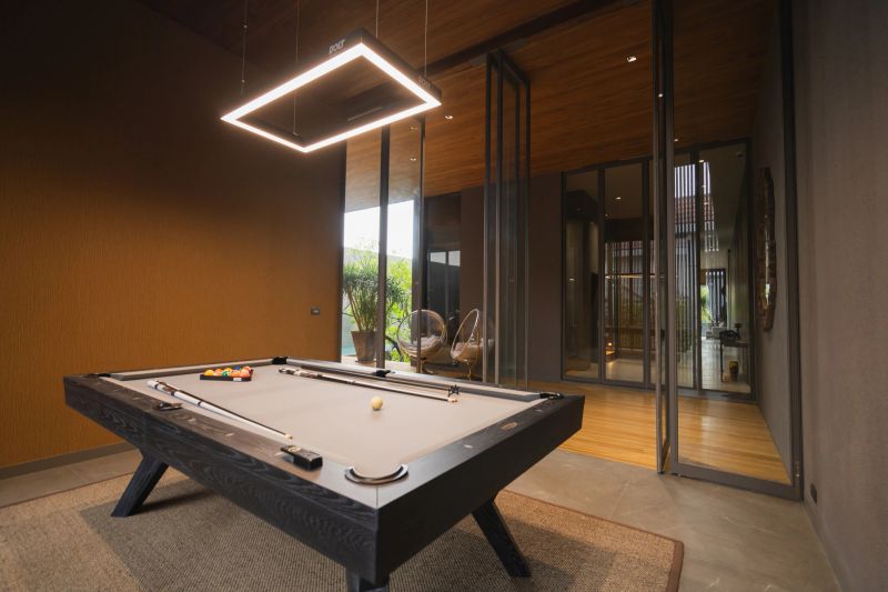 A billiard table in the living room Pool table in game room contemporary home interior design element  home showcase interior