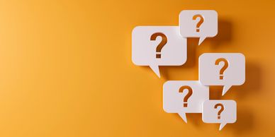 Speech bubbles with question marks on orange background.