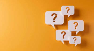 Speech bubbles with question marks on orange background.