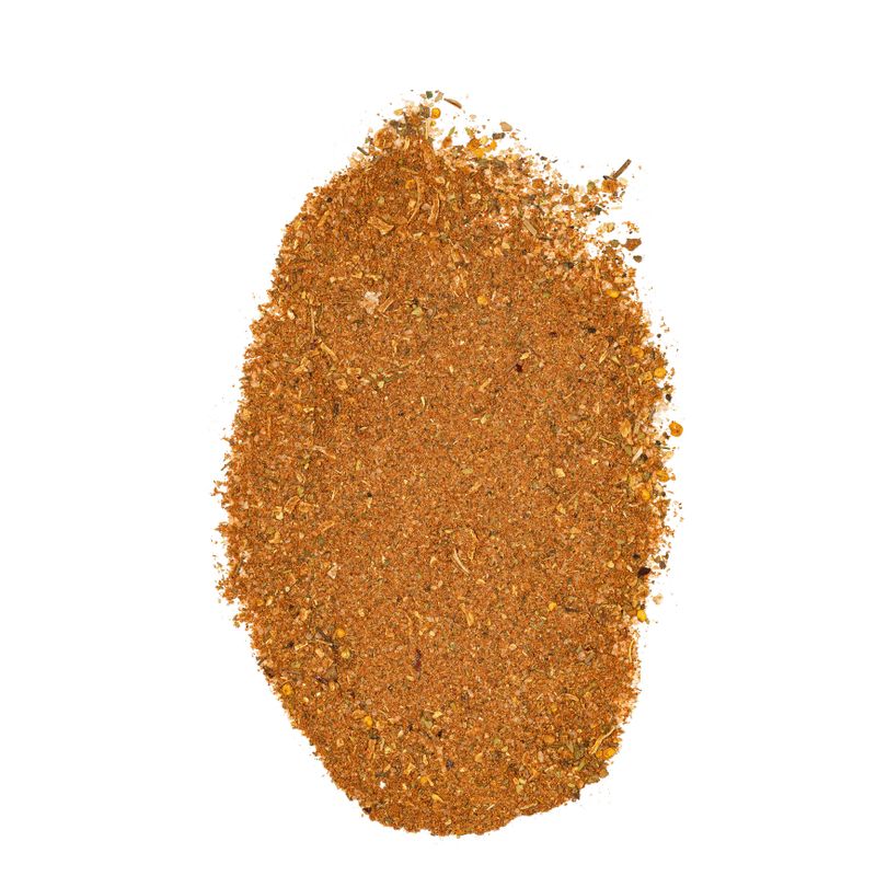 A vibrant heap of organic ground spice blend perfect for enhancing flavors in various dishes. Ideal for cooking and seasoning.