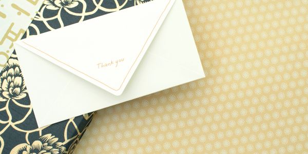 Thank you card on patterned background.