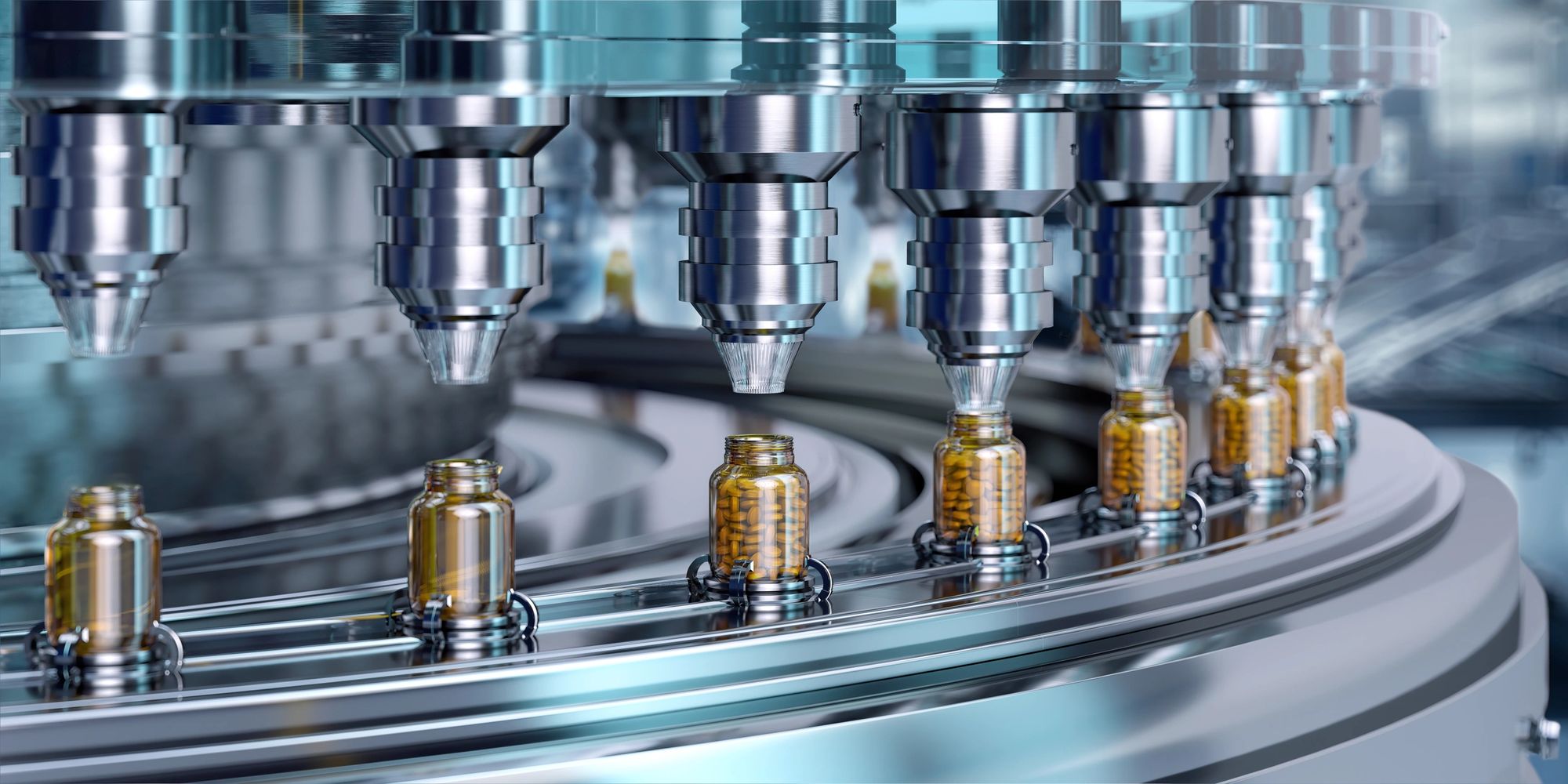 Automated machine filling pill bottles on a pharmaceutical production line.