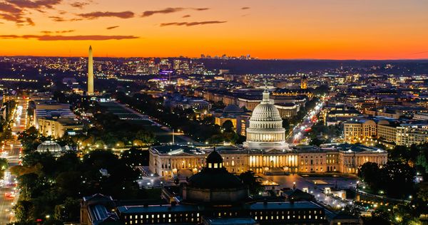 Washington DC skyline at sunset with the Capitol and Washington Monument.