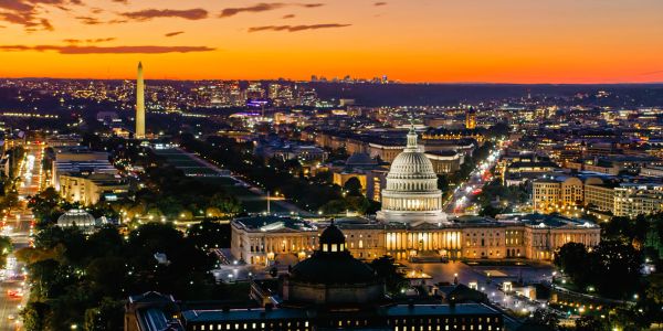 Washington D.C. skyline at sunset with the Capitol and Washington Monument.