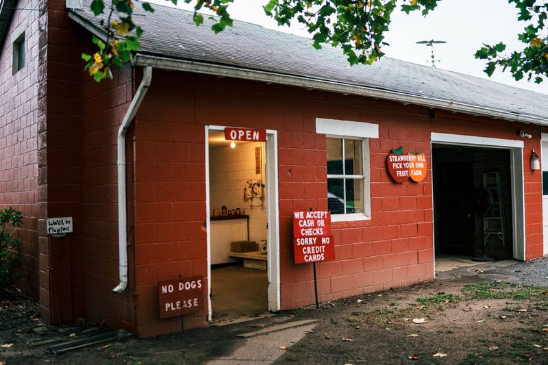 Exterior shot of the storefront at a you-pick farm offering seasonal peaches, apples and pears in a small town in New Jersey, USA.