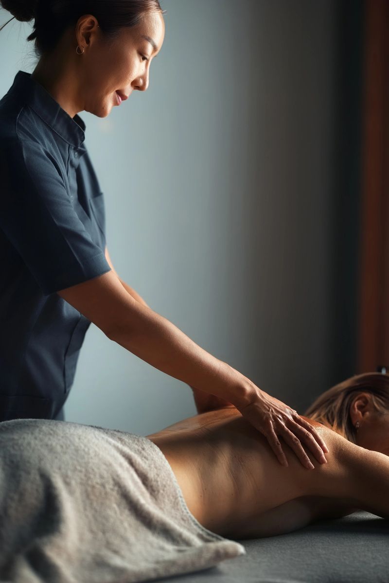 Professional massage therapy session in a calm spa setting, focusing on relaxation and rejuvenation through expert techniques promoting well-being and stress relief.