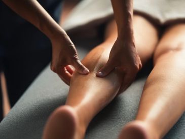 Person receiving a calf massage.