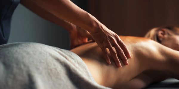 Person receiving a back massage.