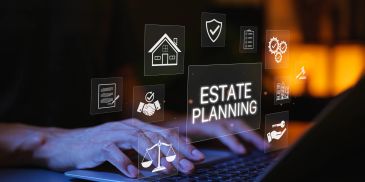 Hands typing on a laptop with estate planning icons floating above.