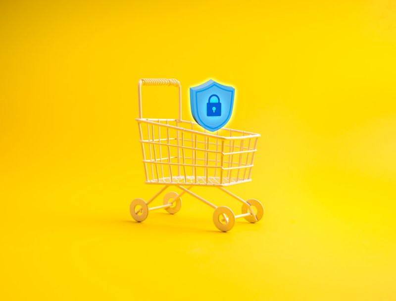 Shopping cart with 3d padlock shield icon on yellow background represents e-commerce security, online shopping protection, data privacy, cybersecurity, payment safety, and secure transactions.