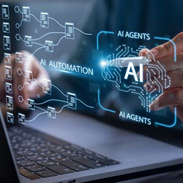 Touchscreen displaying AI automation and agents concept over laptop.
