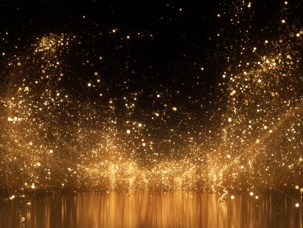 Golden particles sparkle against a dark background, creating a magical glowing effect.