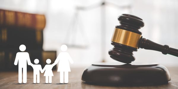 Gavel and family silhouette representing Family Law: divorce, custody, and property division.