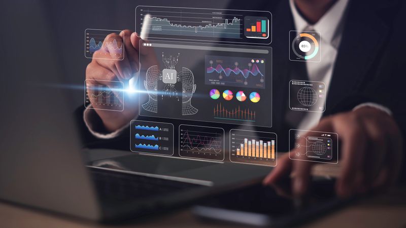 AI finance and AI assistant, data analytics, business intelligence, and financial technology with holographic charts on laptop screen for modern digital strategy and decision making.